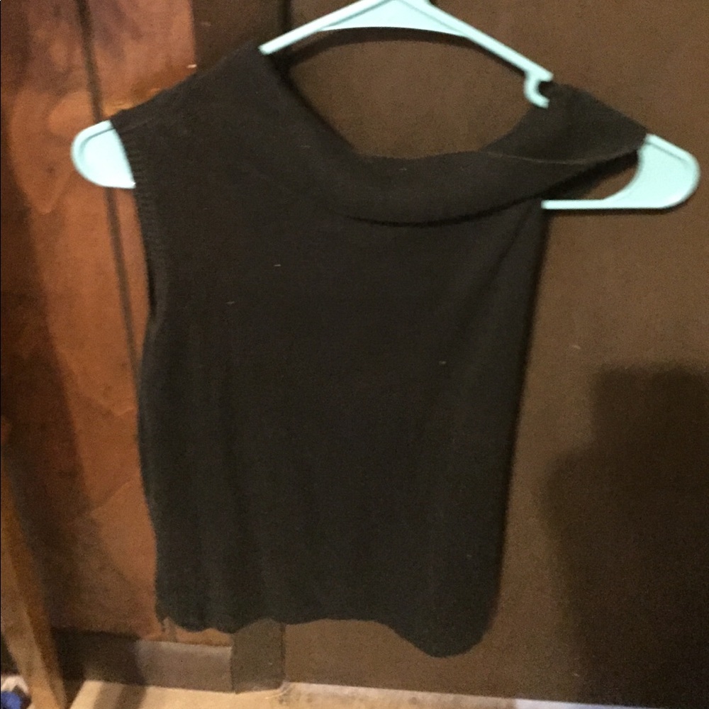 Cropped black turtle neck blouse.